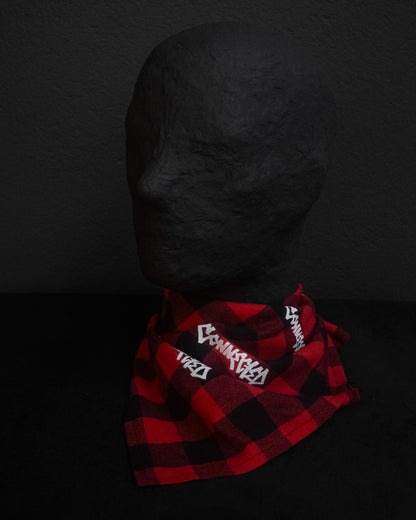 Red and black checkered bandana with white text on a dark background