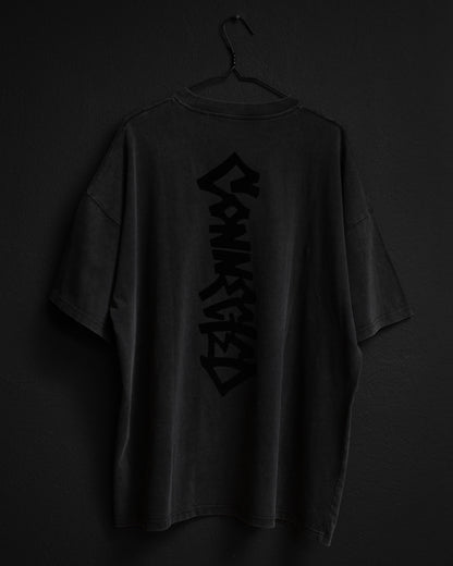 Black t-shirt with text on a dark background