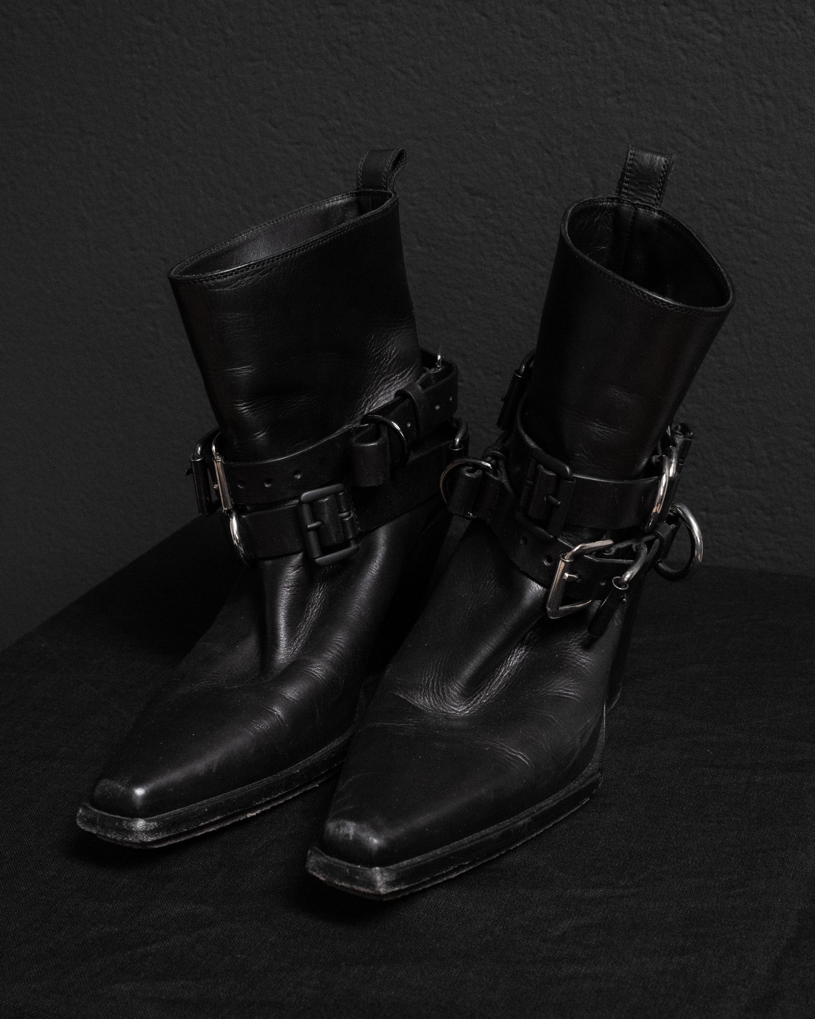 Front view on Ann Demeulemeester black leather belt buckle boots from fall 2019, in size EU 39.