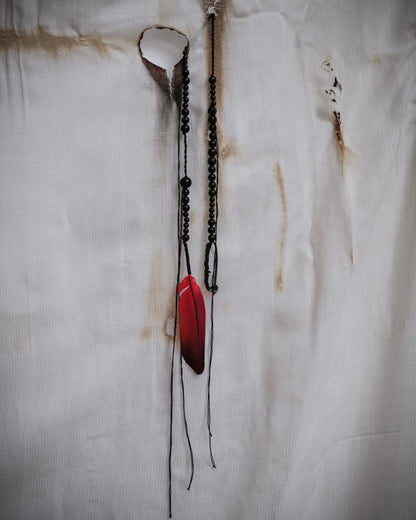 Ann Demeulemeester SS2017 runway necklace with black beads and red feather detail