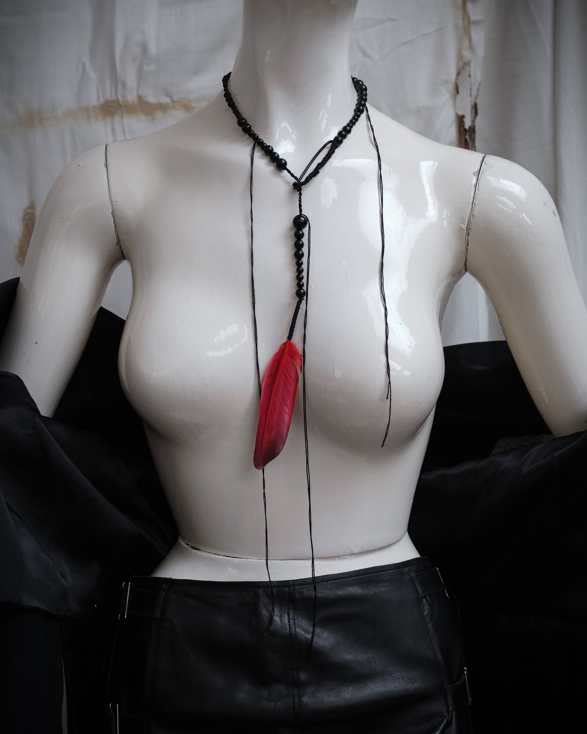 Ann Demeulemeester SS2017 runway necklace with black beads and red feather detail, full view