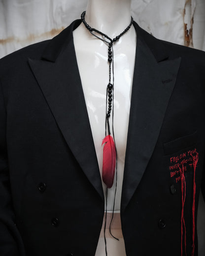 Ann Demeulemeester SS2017 runway necklace with black beads and red feather detail