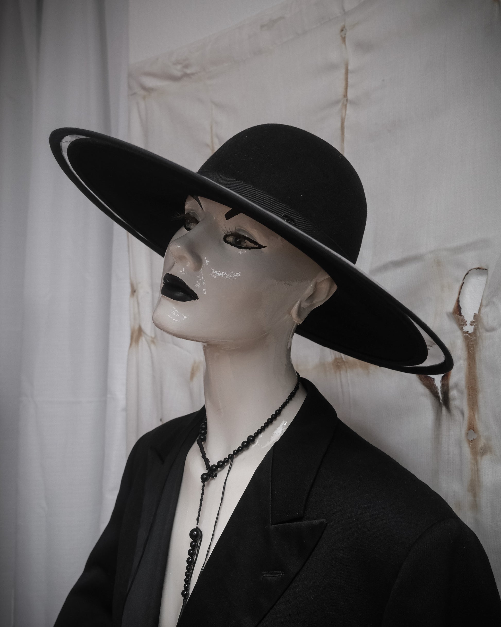 Chanel double brim hat with transparent PVC overlay over wool base, early 2000s sculptural designer piece from side