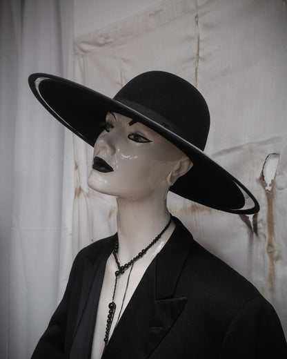 Chanel double brim hat with transparent PVC overlay over wool base, early 2000s sculptural designer piece from side