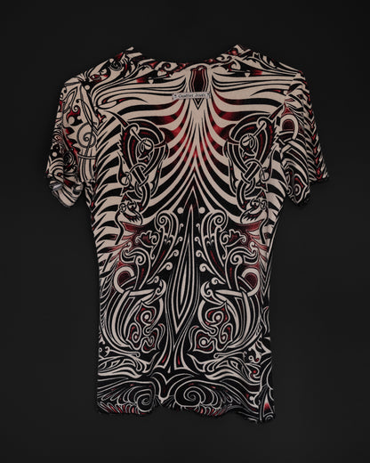 The back of a Jean Paul Gaultier Cyberbaba 1996 tribal tattoo tee in off-white with black and red print