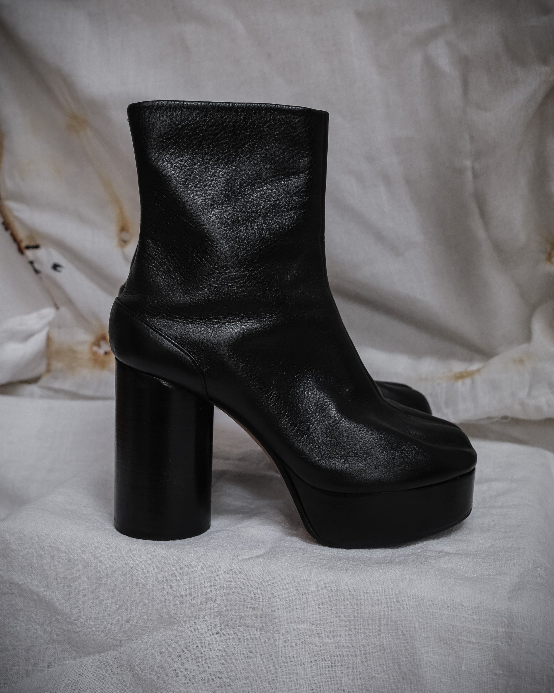 From the side, Maison Margiela Black leather tabi boots with platform heel, iconic vintage piece